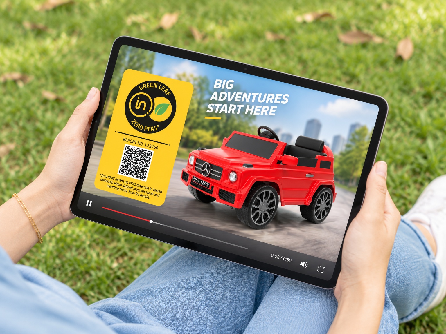 the screen is displaying a video advertisement of the red car toy and the yellow label.