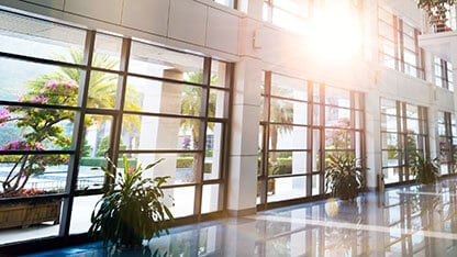 Modern office building with glass wall.