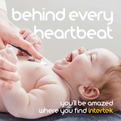 An infant laughing while being touched