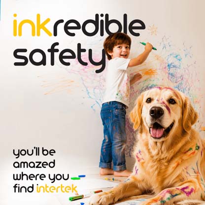 A young boy drawing on a wall while a dog sits idly by covered in marker ink