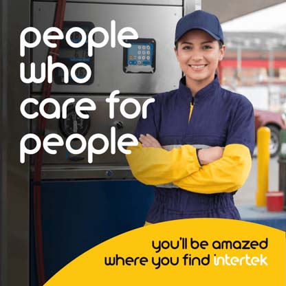 A uniformed employee at a refueling pump