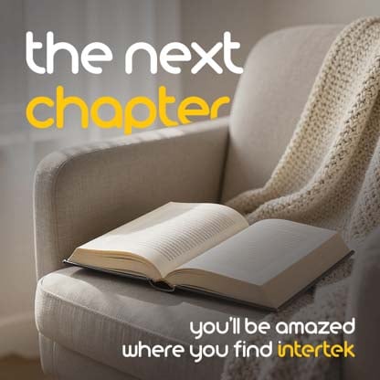 An open book sitting in a lounge chair